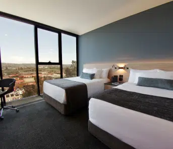 interior view of comfortable hotel room beds